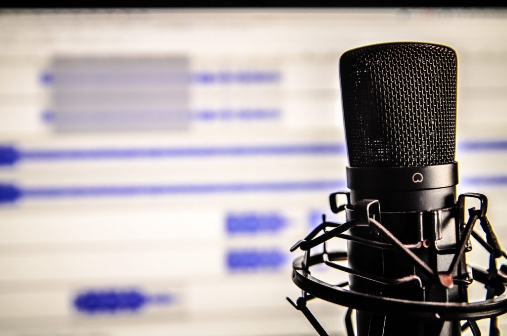 Microphone in front of a podcast edit screen